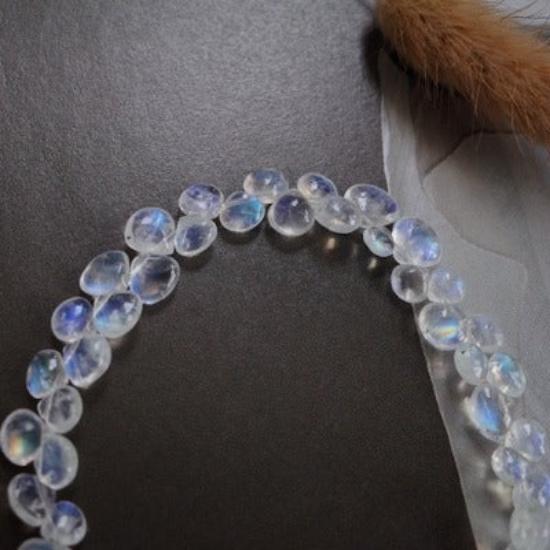 Sri Lankan Moonstone Teardrop Bracelet featuring luminous genuine moonstone gemstones with blue iridescence and delicate 14K gold-filled findings.