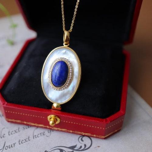 Heirloom Lapis Lazuli & Mother of Pearl Pendant Necklace featuring a genuine oval lapis lazuli gemstone layered over luminous mother of pearl within a gold vermeil frame.