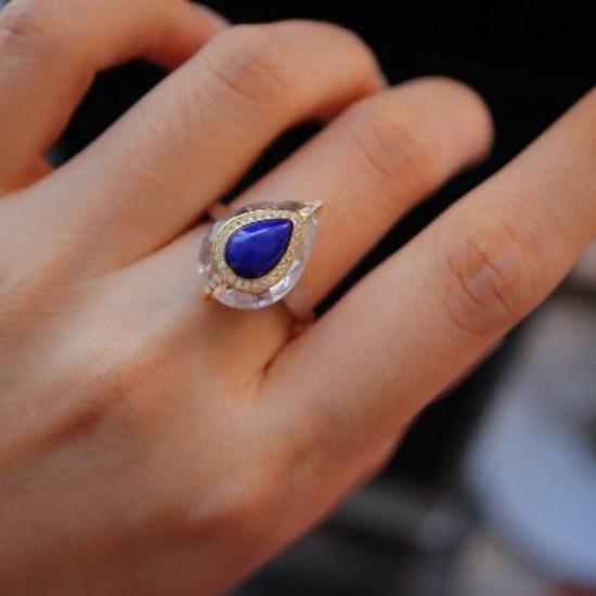 Regal Lapis Lazuli Teardrop Ring featuring a genuine blue lapis lazuli gemstone in a teardrop design surrounded by clear crystal accents on an adjustable sterling silver band.