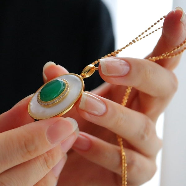 Heirloom Green Onyx & Mother of Pearl Pendant Necklace featuring a genuine oval green onyx gemstone layered over luminous mother of pearl within a gold vermeil frame.