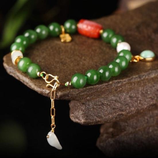 Tibetan Totem Hetian Jade Bracelet featuring genuine green Hetian jade beads, a carved red agate centerpiece, freshwater pearl accents, and gold vermeil findings.