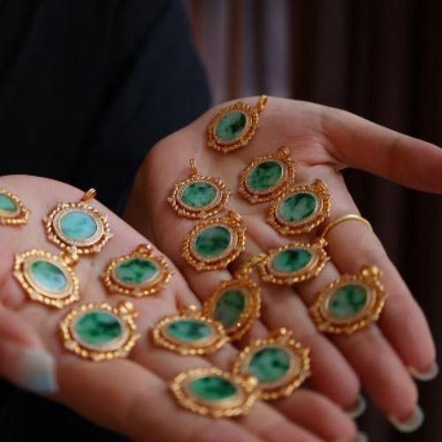 Royal Jade Medallion Necklace featuring a genuine green jade gemstone set within an ornate round gold vermeil medallion pendant accented with sparkling zirconia details.