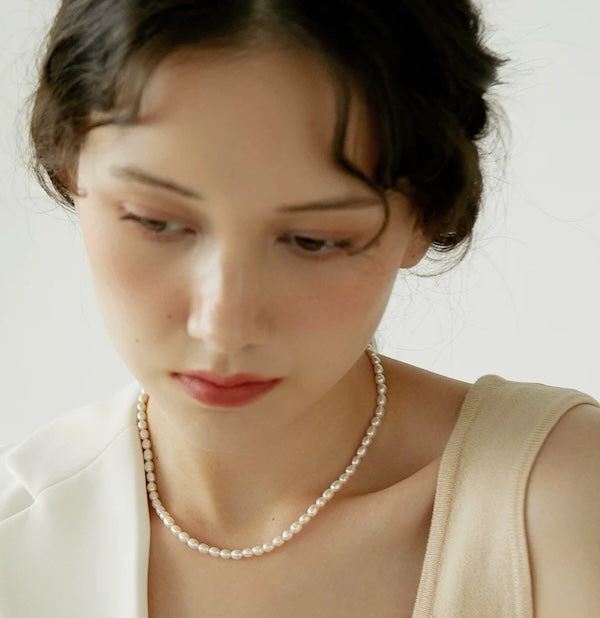 Classic Freshwater Pearl Necklace with Toggle Clasp featuring a strand of genuine freshwater pearls finished with a gold-filled toggle closure.