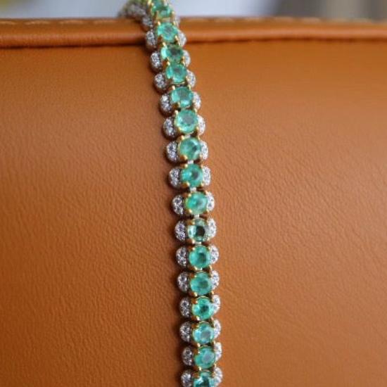 Vintage Emerald Tennis Bracelet featuring genuine emerald gemstones framed by sparkling zirconia accents in a gold vermeil setting.