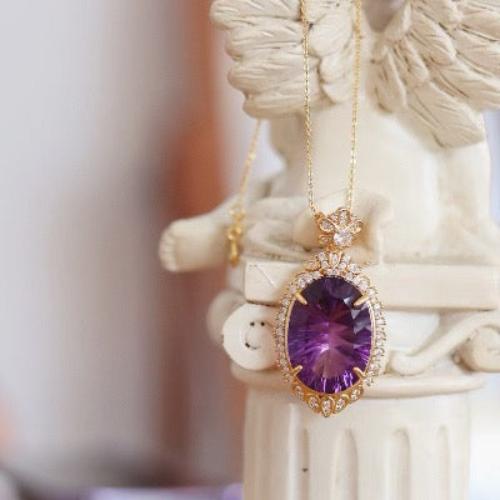 Imperial Amethyst Statement Pendant Necklace featuring a large oval genuine amethyst gemstone surrounded by intricate gold vermeil detailing and sparkling accents.