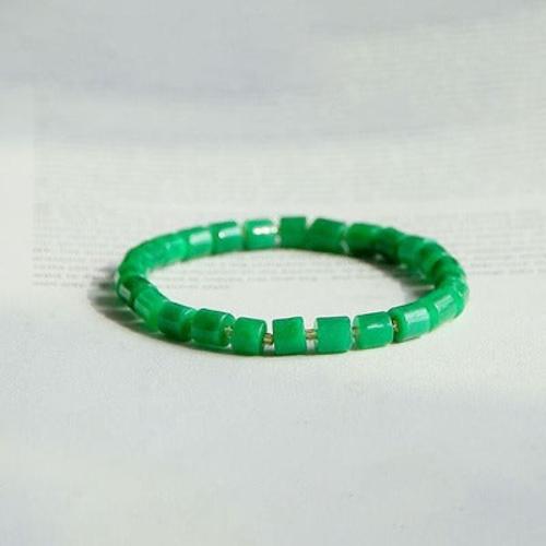 Minimalist Jade Bead Bracelet featuring genuine vivid green jade beads arranged in a simple stretch bracelet design.