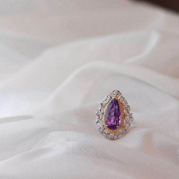 Amethyst Duchess Ring featuring a genuine pear-cut amethyst gemstone surrounded by brilliant sparkling accents in an ornate gold vermeil and sterling silver setting.