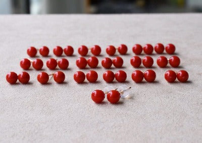 Crimson Coral Sphere Ear Studs featuring polished genuine red coral gemstones in a classic 18K gold stud setting.