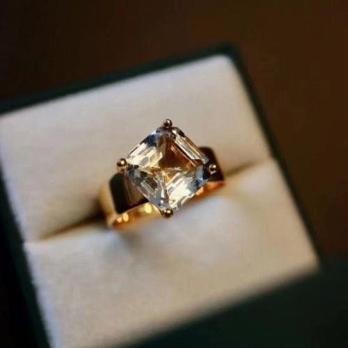 Princess-Cut Quartz Cocktail Ring featuring a large faceted clear quartz gemstone set in an elegant gold vermeil adjustable band.