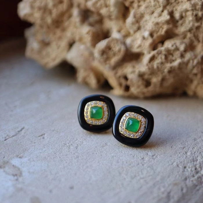 Vintage Black Onyx Halo Ear Studs featuring polished black onyx, a choice of lapis lazuli or green onyx center stones, and sparkling halo accents in a gold vermeil setting.