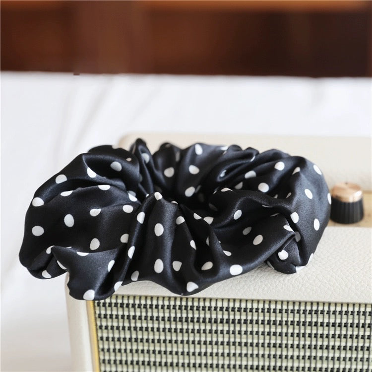 Classic Polka Dot Silk Hair Scrunchie crafted from 100% 19 momme mulberry silk, available in emerald green, black, chocolate brown, and white.