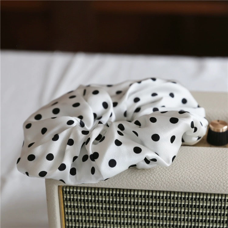 Classic Polka Dot Silk Hair Scrunchie crafted from 100% 19 momme mulberry silk, available in emerald green, black, chocolate brown, and white.
