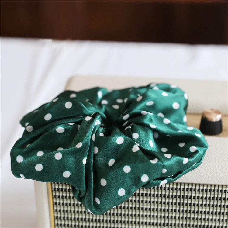 Classic Polka Dot Silk Hair Scrunchie crafted from 100% 19 momme mulberry silk, available in emerald green, black, chocolate brown, and white.