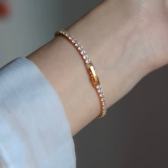 Timeless Diamond-Look Tennis Bracelet featuring a continuous row of premium-grade zirconia set in a classic gold-tone tennis bracelet design.