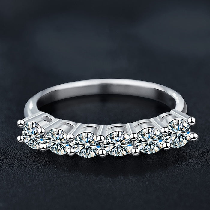 Sparkling Half Eternity Moissanite Ring in sterling silver featuring six brilliant 0.5 ct moissanite stones with a total weight of 3 ct.
