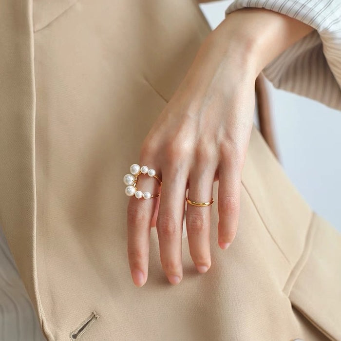 Statement U-Shape Pearl Ring featuring graduated faux pearls arranged along a sculptural U-shaped gold-tone band.