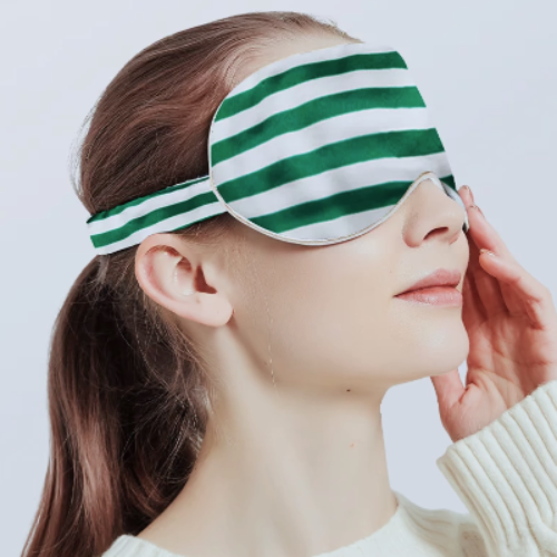 Oversized 100% silk sleep mask in striped patterns crafted from 19 momme silk for enhanced light blockage and comfortable sleep.