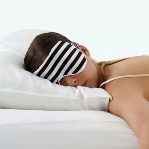 Oversized 100% silk sleep mask in striped patterns crafted from 19 momme silk for enhanced light blockage and comfortable sleep.