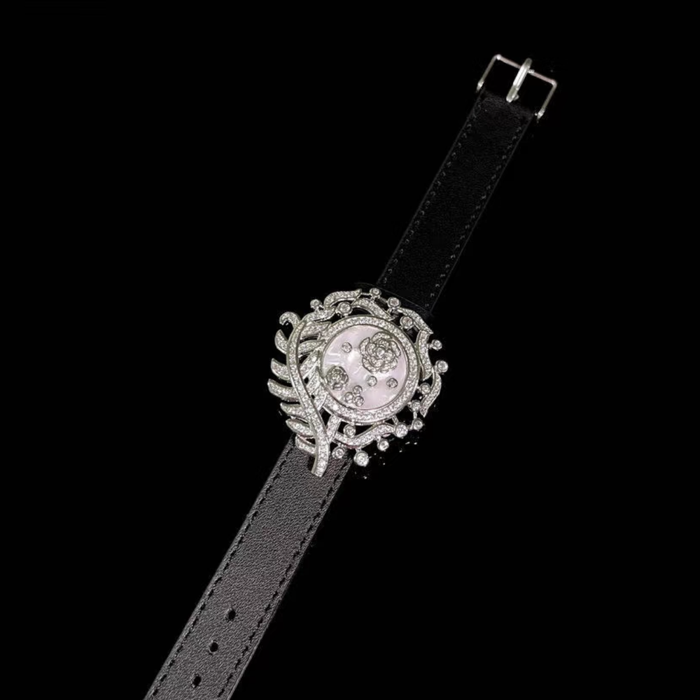 Camellia Convertible Watch Style Bracelet featuring a detachable mother-of-pearl and premium-grade zirconia centerpiece on a black PU leather strap with a luxurious watch-inspired design.