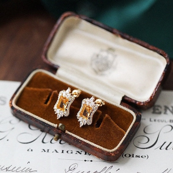 Citrine Royal Style Ear Studs featuring genuine citrine gemstones framed by sparkling AAAA zirconias in a sterling silver setting.