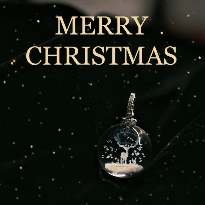 Clear Quartz Reindeer Necklace featuring a genuine clear quartz crystal pendant with a delicate reindeer motif suspended from a sterling silver chain.
