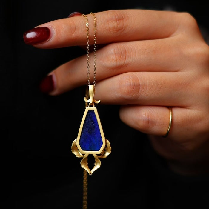 Royal Crest Shield Lapis Lazuli Pendant Necklace featuring a genuine deep-blue lapis lazuli stone set within an ornate gold vermeil shield-shaped pendant.