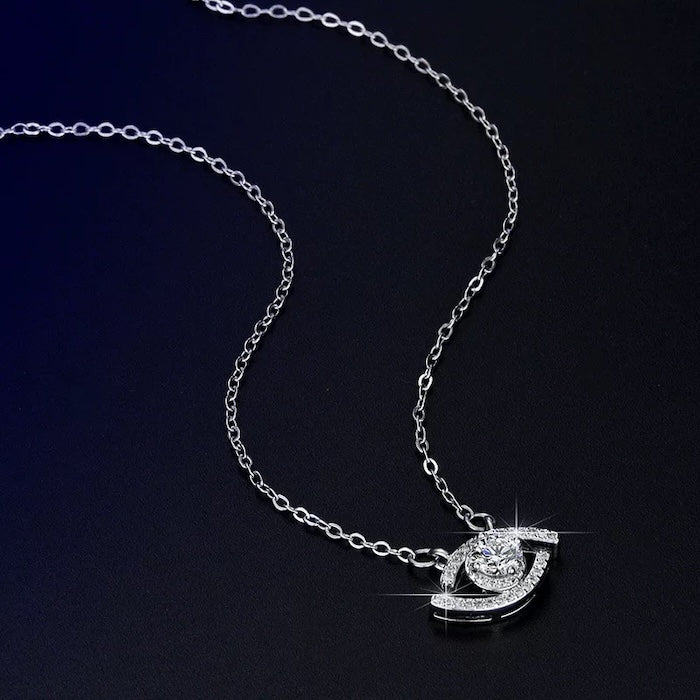Lucky Eye Moissanite Necklace with a sparkling 0.5 ct center stone set in an eye-shaped pendant with pavé accents, available in sterling silver and gold vermeil.