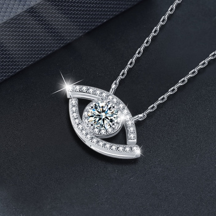 Lucky Eye Moissanite Necklace with a sparkling 0.5 ct center stone set in an eye-shaped pendant with pavé accents, available in sterling silver and gold vermeil.