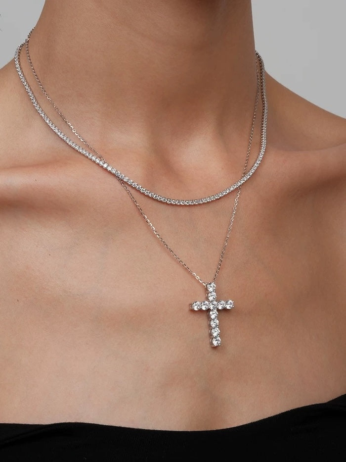 Moissanite Cross Pendant Necklace featuring a sterling silver cross pendant set with eleven sparkling moissanite stones, measuring 2.8 × 0.3 cm.