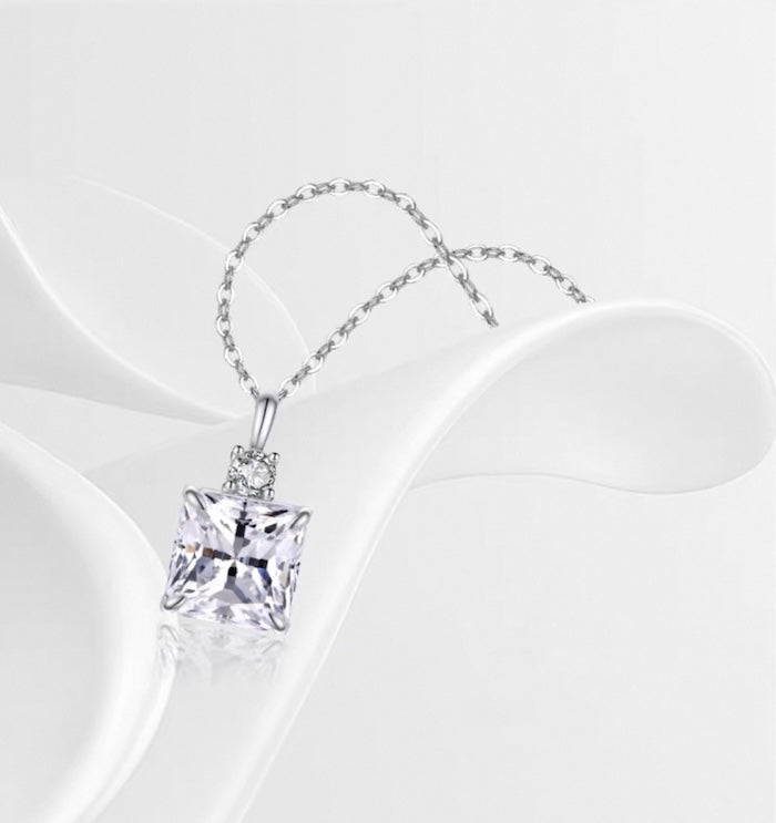 Princess Cut Moissanite Pendant Necklace featuring a sparkling 1.5 ct princess-cut moissanite pendant suspended from a sterling silver chain.