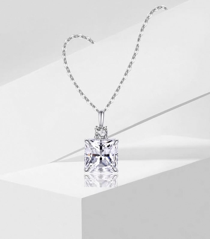Princess Cut Moissanite Pendant Necklace featuring a sparkling 1.5 ct princess-cut moissanite pendant suspended from a sterling silver chain.