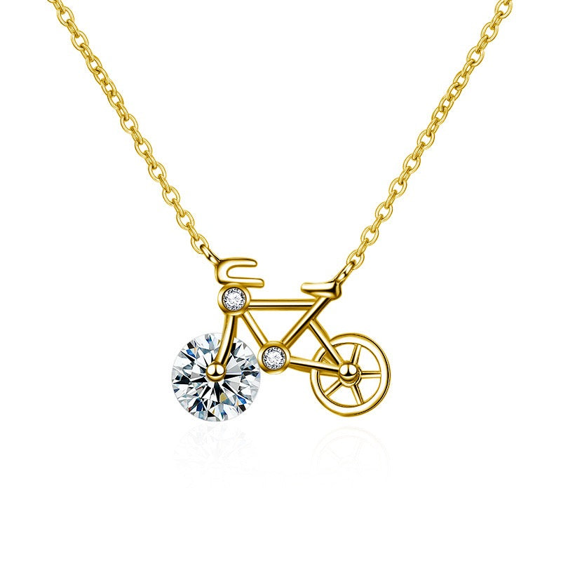 Moissanite Bicycle Necklace featuring a bicycle-shaped pendant with a sparkling 1 ct moissanite front wheel in a sterling silver setting.