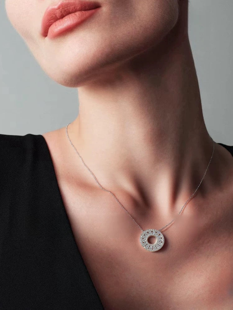 Radiant Orbit Moissanite Circle Necklace featuring concentric circles of brilliant moissanite stones in a sparkling open-circle sterling silver pendant.