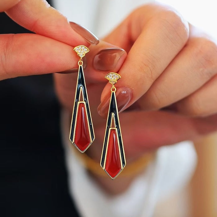 Geometric Red Agate Drop Earrings featuring genuine red agate stones set within a black and gold geometric frame in a vintage-inspired design.