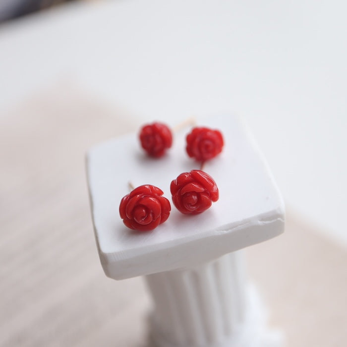 Crimson Coral Rose Ear Studs featuring genuine red coral gemstones hand-carved into blooming rose designs with elegant 18K gold findings.