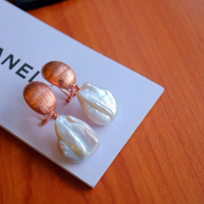Lustre Baroque Pearl Drop Earrings featuring hand-selected genuine baroque pearls suspended from brushed rose gold vermeil sterling silver studs.