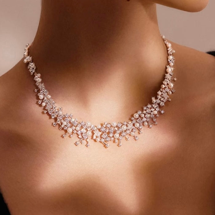 Starlight Pearl Bridal Jewelry Set featuring a matching necklace and earrings with luminous pearls and sparkling premium-grade zirconia accents.
