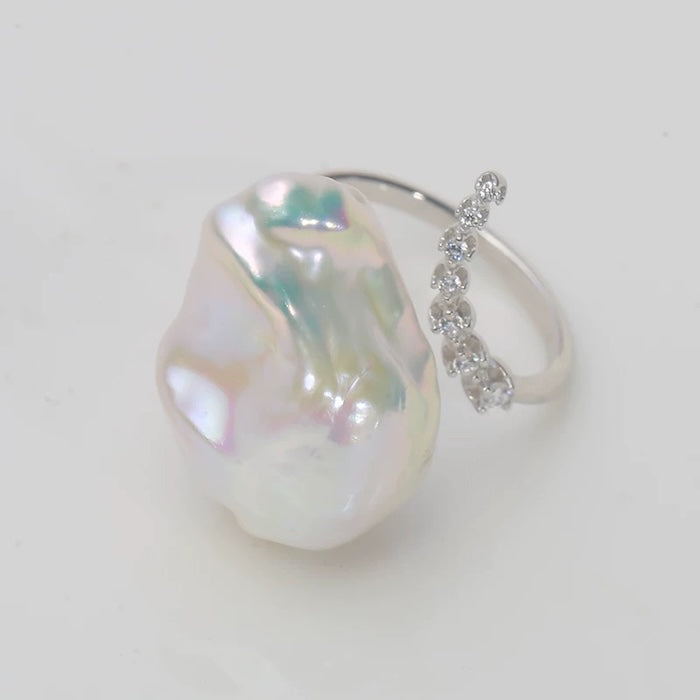 Luminous Baroque Pearl Ring featuring a genuine baroque pearl with sparkling zirconia accents on a sterling silver adjustable band.