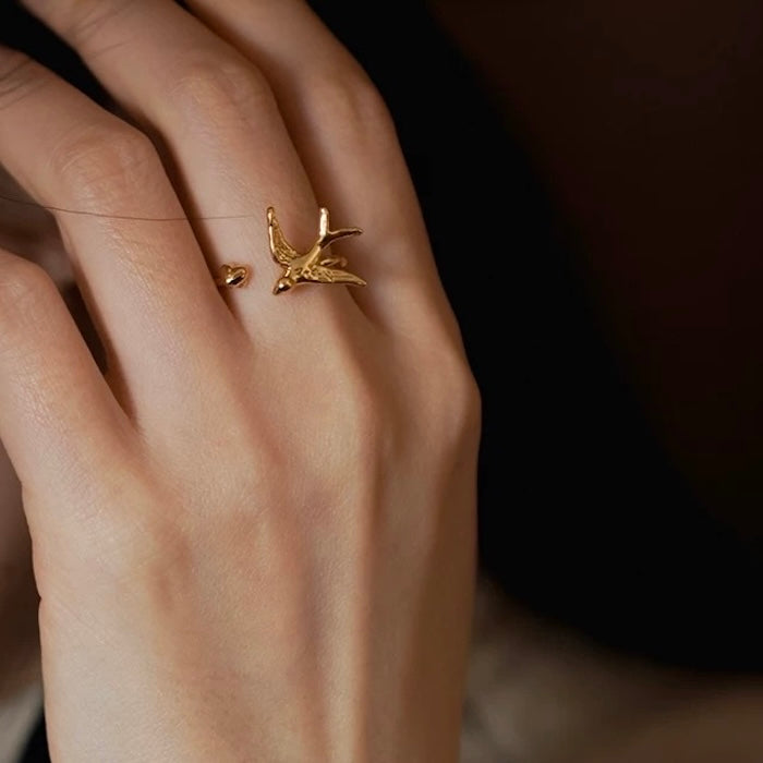 Artistic Swallow Bird Ring featuring a sculptural swallow bird design in gold and silver-tone finishes with an adjustable open-ring style.