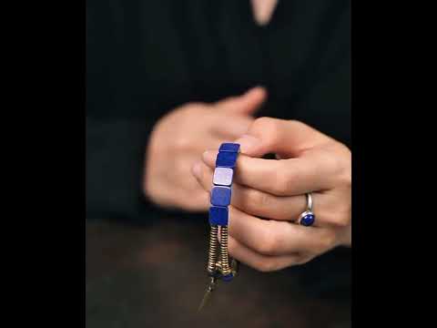 Lapis Lazuli Square Bead Bracelet featuring genuine deep-blue lapis lazuli square beads, layered bronze-toned bangles, and a vintage-inspired charm.