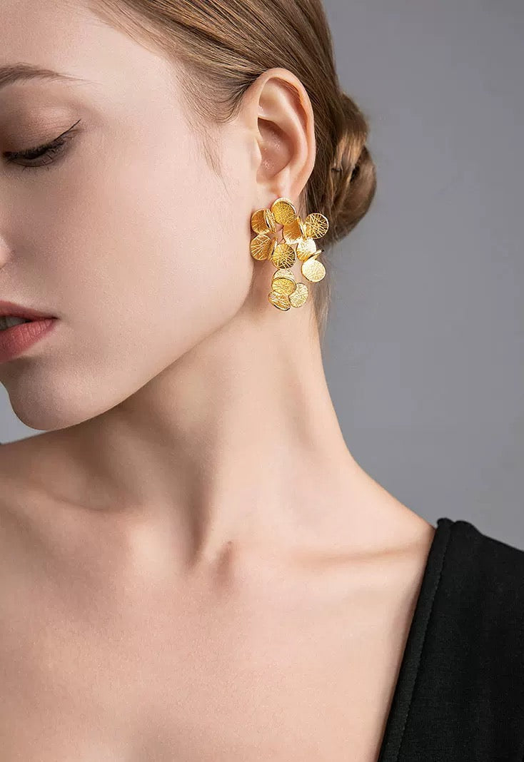 Golden Petal Bouquet Earrings featuring textured gold-plated cascading petals arranged in a sculptural bouquet-inspired drop design.