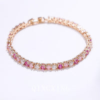 Dazzling Pink Ombré Tennis Bracelet featuring sparkling pink and clear zirconias in a gradient tennis bracelet design, available in two stone sizes.
