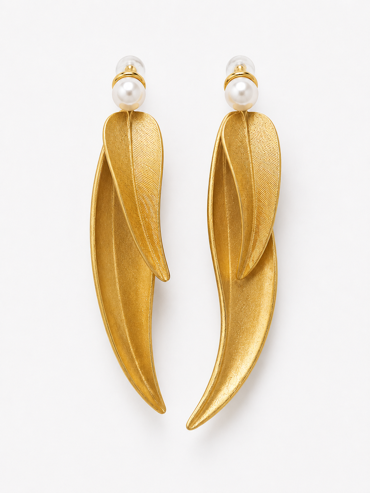 Golden cascading leaf earrings with layered curved leaves and white pearl studs.