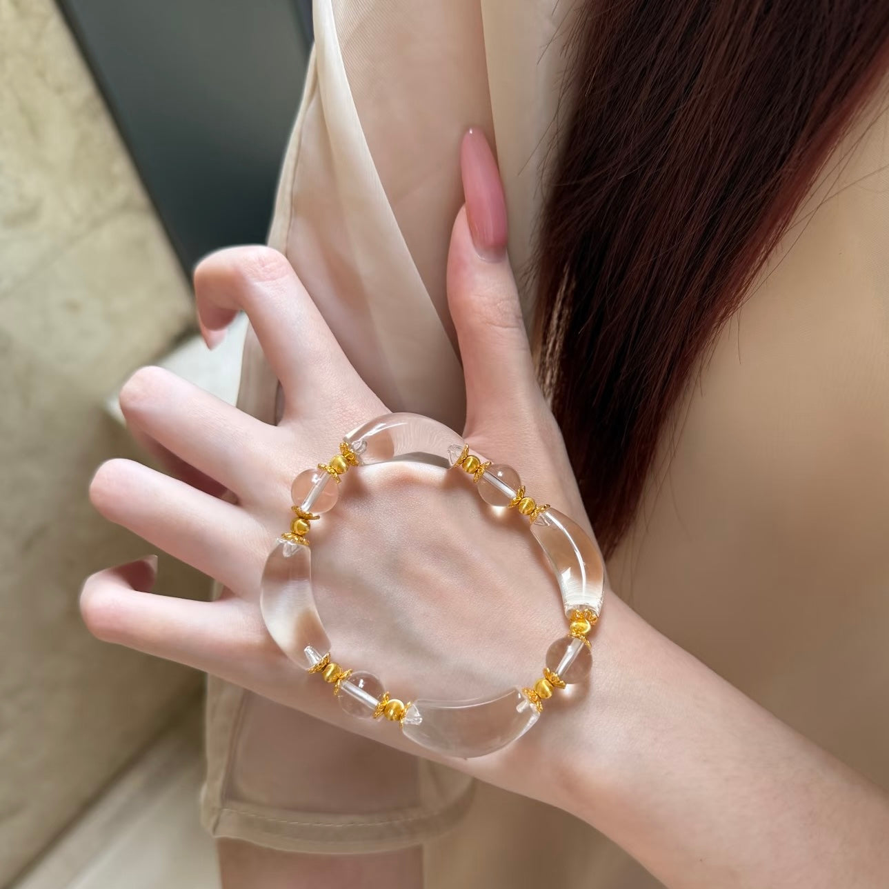 Moonlit Clear Quartz Crystal Bracelet featuring genuine moon-shaped clear quartz crystals, polished round quartz beads, and gold vermeil separation beads in a handcrafted floral-inspired design.