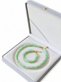 Lucky Jade Braided Necklace and Bracelet Set featuring genuine jade beads in an intricate braided design with gold-tone accents, convertible into a longer necklace.