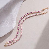 Dazzling Pink Ombré Tennis Bracelet featuring sparkling pink and clear zirconias in a gradient tennis bracelet design, available in two stone sizes.