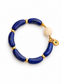 Imperial Lapis Lazuli Guardian Bracelet featuring genuine curved lapis lazuli beads, a hand-carved guardian bead, and gold vermeil accents in a handcrafted vintage-inspired design.
