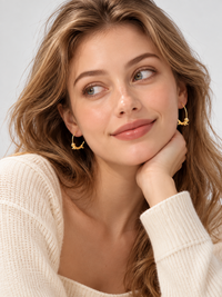 Charming Dachshund Hoop Earrings in 18K gold filled featuring a sculpted dachshund seamlessly integrated into a polished hoop design.