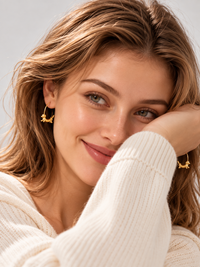 Charming Dachshund Hoop Earrings in 18K gold filled featuring a sculpted dachshund seamlessly integrated into a polished hoop design.