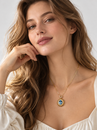 Heirloom Blue Topaz Pendant Necklace featuring an oval genuine blue topaz gemstone surrounded by ornate gold vermeil detailing and delicate sparkling accents.